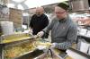 RUTH BONNEVILLE / WINNIPEG FREE PRESS
                                Local Salvation Army Dinner prep Mark Stewart (hat), Executive Director of Winnipeg Salvation Army Centre of Hope and Chef Dan Krupka, make up some sample testing plates in preparation for hosting an early Christmas Dinner tomorrow. The hot, turkey dinner will include all the trimmings including dessert for up to 1500 guests, many of them homeless or living in shelters around their neighbourhood on Main Street. Dec 19th, 2023