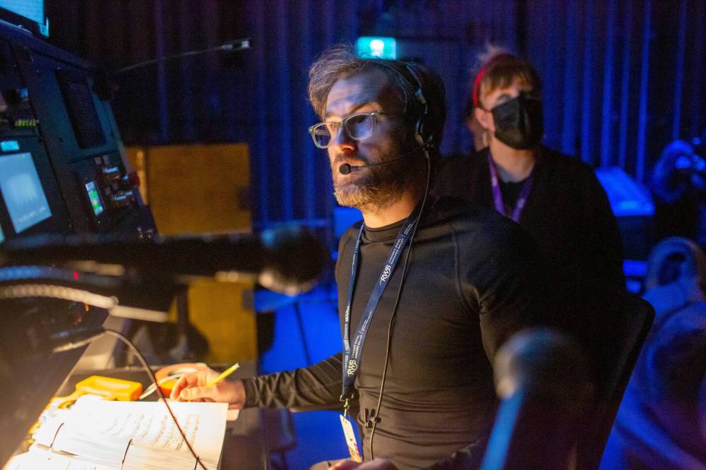 BROOK JONES / WINNIPEG FREE PRESS 
Mike Duggan (left), who is the stage manager calling the cues, is pictured backstage with Candace Jacobson (background), who is the stage manager at the Royal Winnipeg Ballet, during opening night of the Royal Winnipeg Ballet's production of the Nutcracker at the Centennial Concert Hall in Winnipeg, Man., Thursday, Dec. 21, 2023.