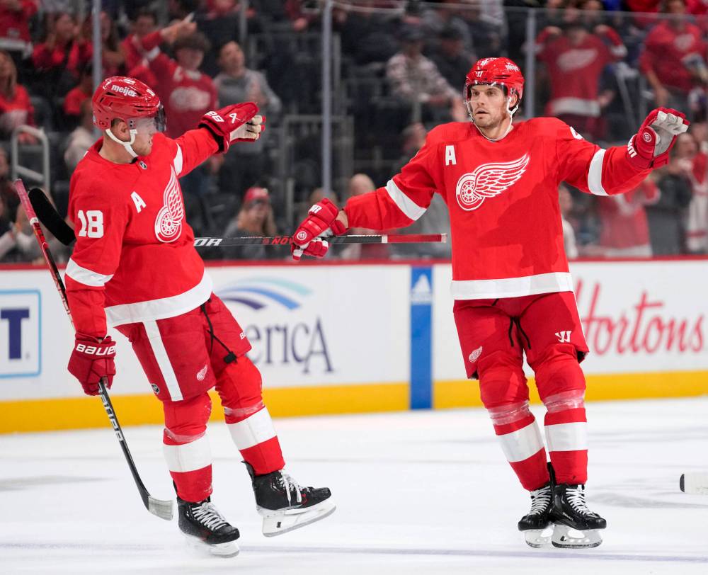 Paul Sancya / The Associated Press files
Former Jets Andrew Copp (left) and Ben Chiarot are now part of the leadership group with the Detroit Red Wings.