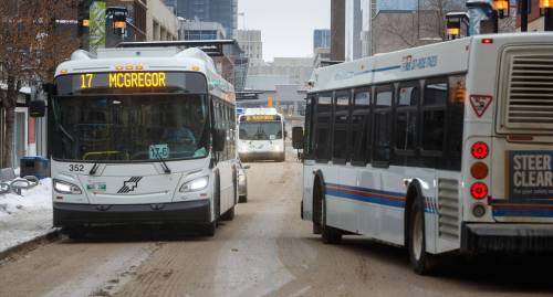 MIKE DEAL / WINNIPEG FREE PRESS A Winnipeg Transit bus drives along Graham Avenue Thursday afternoon. 230126 - Thursday, January 26, 2023.