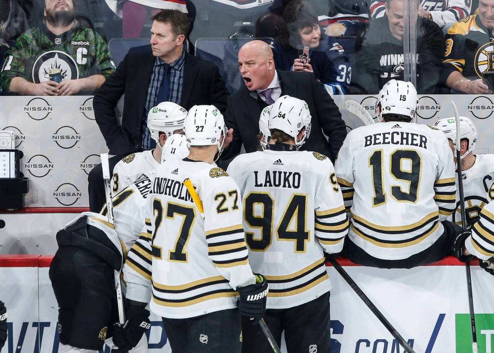 THE CANADIAN PRESS/John Woods
Boston Bruins head coach Jim Montgomery talks to his team during a break in first period NHL action against the Winnipeg Jets in Winnipeg on Friday.