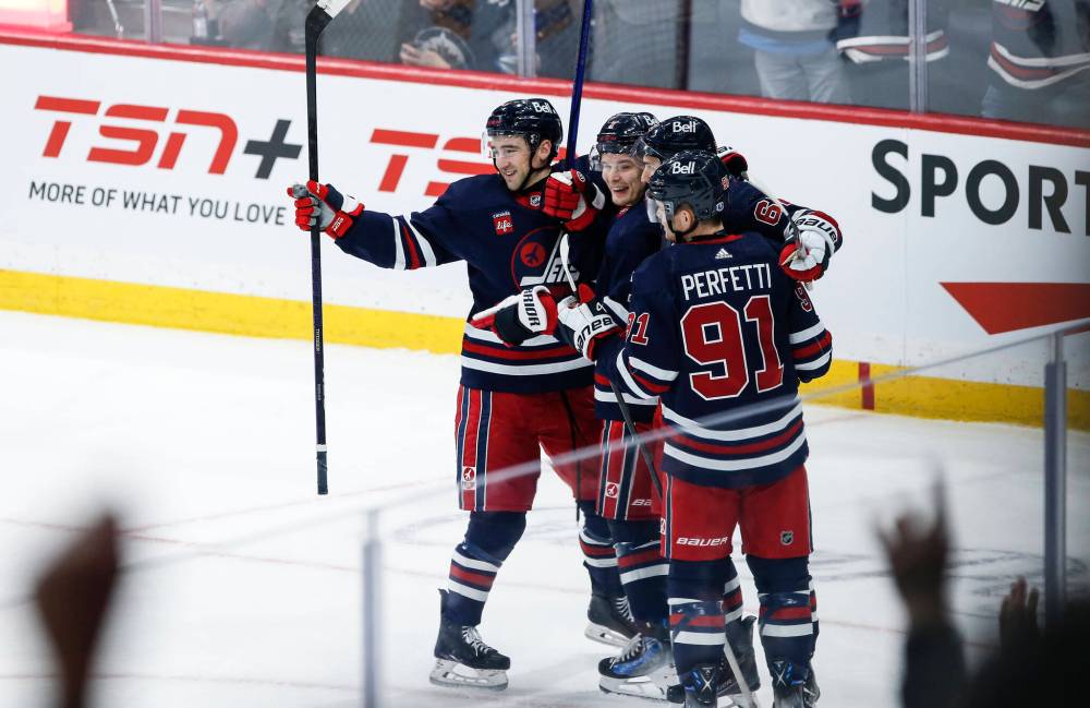THE CANADIAN PRESS/John Woods
Winnipeg Jets’ Neal Pionk, Vladislav Namestnikov, Nino Niederreiter and Cole Perfetti celebrate Niederreiter’s goal against the Boston Bruins during the second period in Winnipeg on Friday.