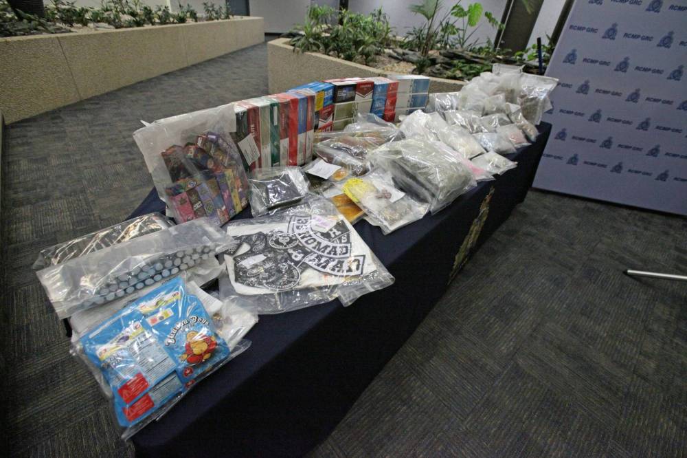 Illicit cannabis products, gang patches, cigarettes and other goods seized in a large RCMP drug investigation on March 14. (Erik Pindera / Winnipeg Free Press files)