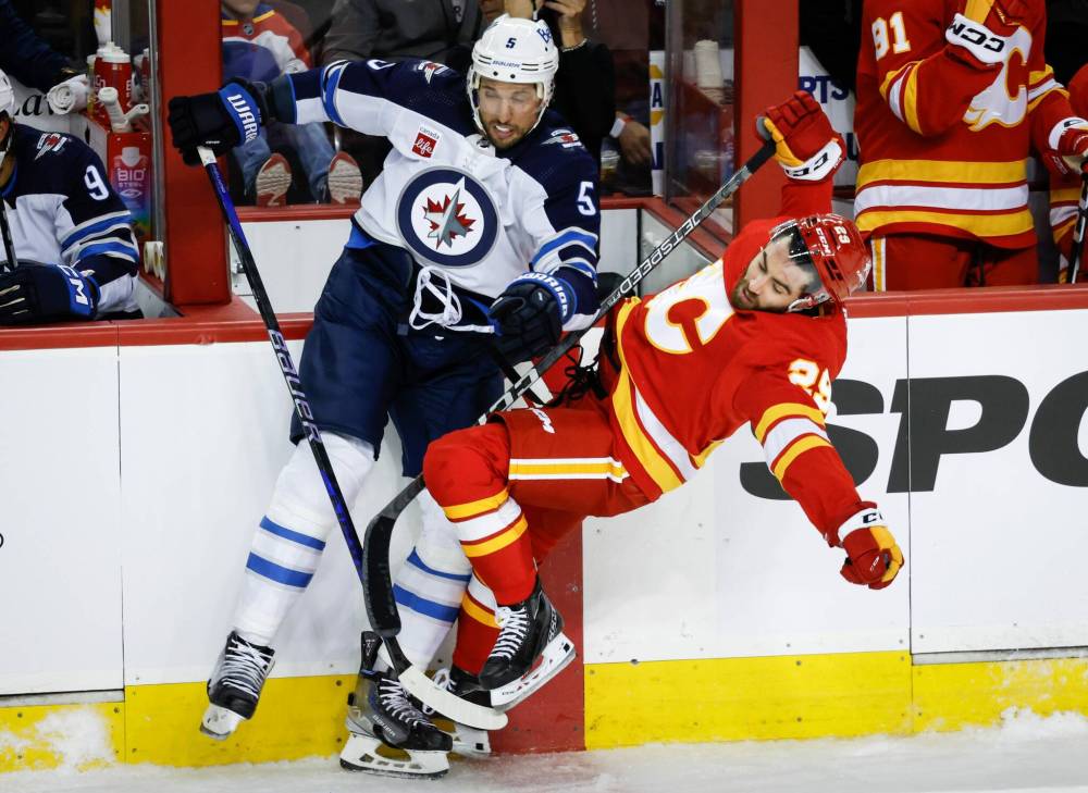 JEFF MCINTOSY / CANADIAN PRESS FILES
Jets blue-liner Brenden Dillon’s (left) five goals come in addition to his strong physical play.