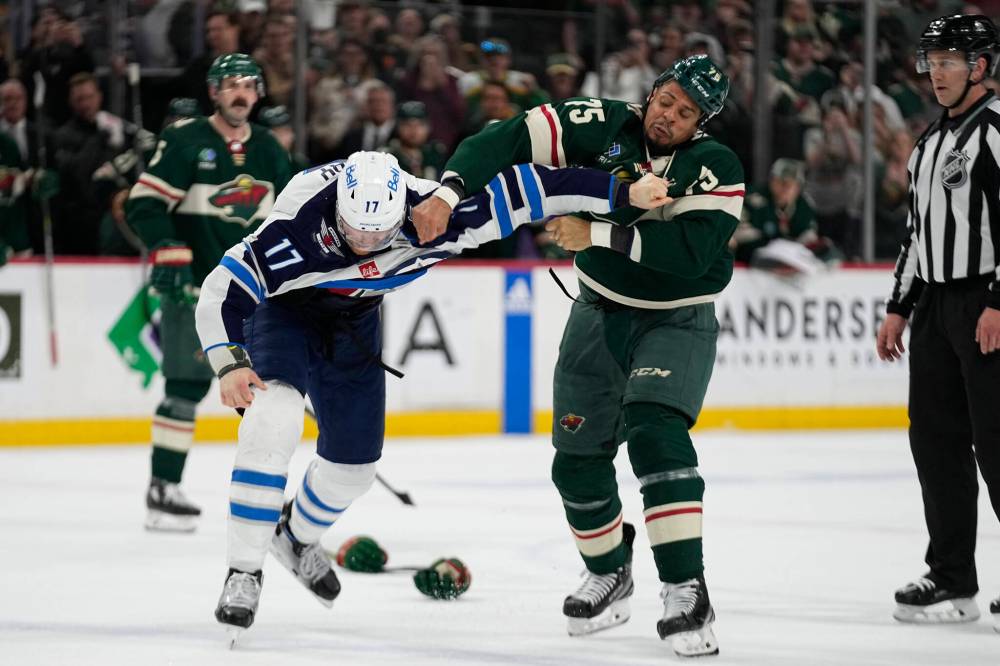 ABBIE PARR / ASSOCIATED PRESS FILES
                                Adam Lowry dropped the gloves with Wild enforcer and Winnipegger Ryan Reaves last April in what was a spirited tilt.