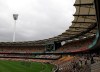 FILE - Spectators make their way home after play had been suspended due to heavy rain during the second day of the first cricket test match between Australia and South Africa at the Gabba stadium in Brisbane, Australia, Saturday, Nov. 10, 2012. The cricket stadium that Brisbane Olympics backers pitched as the centerpiece venue for the 2032 Summer Games is set to be demolished and rebuilt.(AP Photo/Tertius Pickard, File)