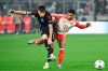 Copenhagen's Kevin Diks, left, and Munich's Serge Gnabry battlef for the ball during the Champions League Group A soccer match between Bayern Munich and FC Copenhagen at Allianz Arena, Munich, Germany, Wednesday Nov. 29, 2023. (Sven Hoppe/dpa via AP)