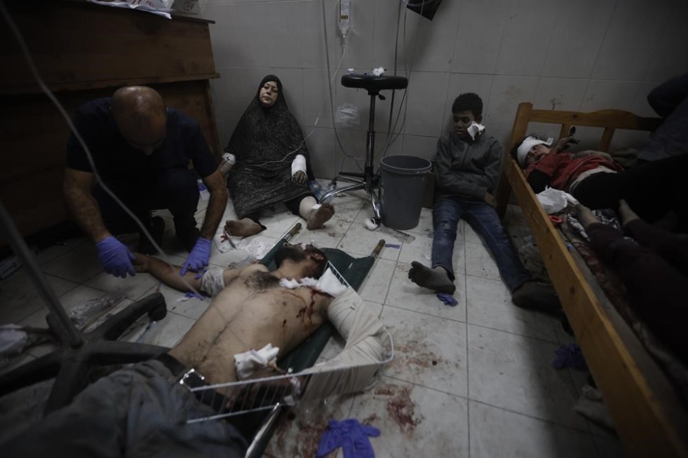Palestinians wounded in the Israeli bombardment of the Gaza Strip arrive at a hospital in Khan Younis on Friday, Dec. 8, 2023. (AP Photo/Mohammed Dahman)