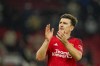 Manchester United's Harry Maguire applauds at the end of the English Premier League soccer match between Manchester United and Chelsea at Old Trafford stadium in Manchester, England, Wednesday, Dec. 6, 2023. (AP Photo/Dave Thompson)