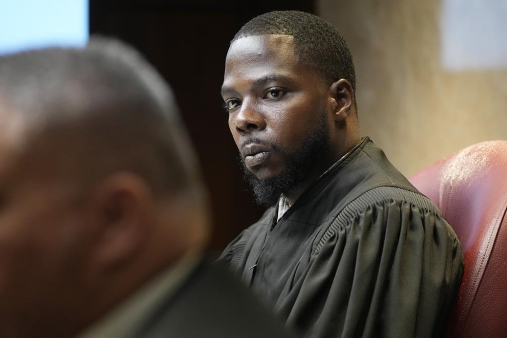 FILE -Oakland County Judge Kwame Rowe looks towards witness during cross examination, July 27, 2023, in Pontiac, Mich. A court hearing is underway, Friday, Dec. 8, as a Rowe hears from families and surviving victims of the Oxford school shooting. Ethan Crumbley could be sentenced to life in prison. (AP Photo/Carlos Osorio, File)
