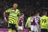 Arsenal's Ben White reacts disappointed after the English Premier League soccer match between Aston Villa and Arsenal at Villa Park in Birmingham, England, Saturday, Dec. 9, 2023. (AP Photo/Rui Vieira)