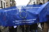 Protesters hold signs and banners as they march during an anti-Semitism demonstration in Brussels, Sunday, Dec. 10, 2023. (AP Photo/Nicolas Landemard)