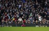 Fulham's Harry Wilson scores their side's fourth goal of the game during the English Premier League soccer match between West Ham United and Fulham FC at Craven Cottage in London, Sunday Dec. 10, 2023. (Adam Davy/PA via AP)