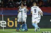 Girona's Miguel Gutierrez, left, celebrates with teammates after scoring his side's second goal during the Spanish La Liga soccer match between Barcelona and Girona at the Olimpic Lluis Companys stadium in Barcelona, Spain, Sunday, Dec. 10, 2023. (AP Photo/Joan Monfort)