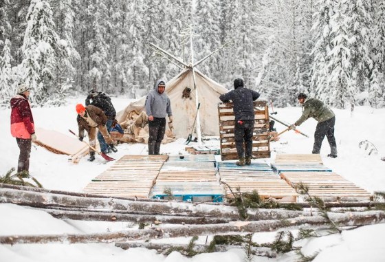 Supporters of the Wet'suwet'en hereditary chiefs and who oppose the Costal GasLink pipeline, work on a support camp just outside of Gidimt'en checkpoint near Houston B.C., on Thursday, Jan. 9, 2020. A report by Amnesty International says police in British Columbia conducted arbitrary arrests and 
