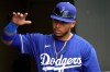 FILE - Los Angeles Dodgers' Jorbit Vivas motions to teammates prior to a spring training baseball game against the Oakland Athletics, March 9, 2023, in Mesa, Ariz. The Dodgers acquired shortstop prospect Trey Sweeney from the New York Yankees for left-hander Victor González and Vivas, opening roster spots for Shohei Ohtani and Joe Kelly, Monday, Dec. 11. (AP Photo/Matt York, file)