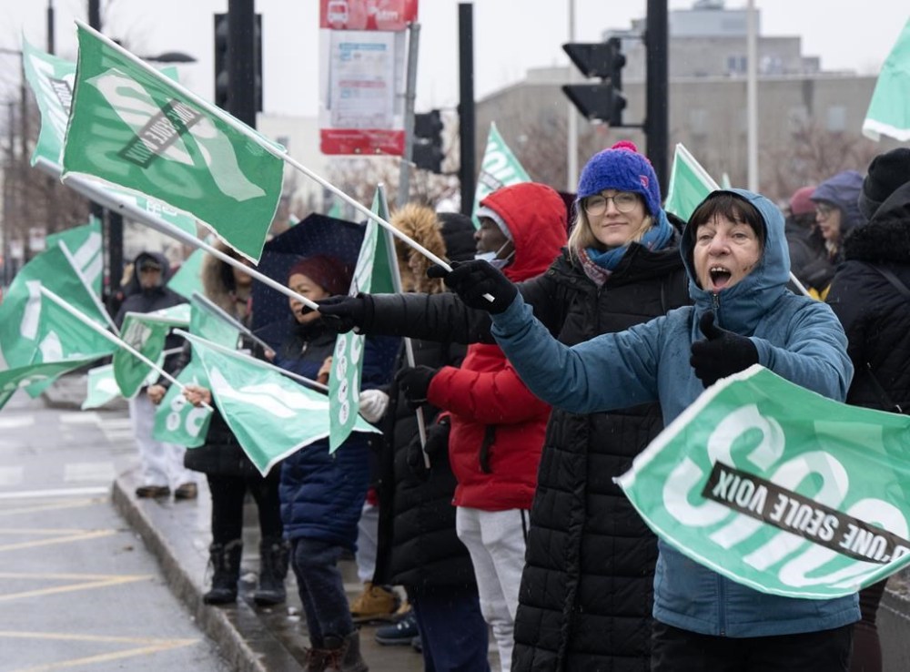 Striking health-care workers picket in front of the McGill University Health Centre hospital Monday, Dec. 11, 2023, in Montreal, Que. THE CANADIAN PRESS/Ryan Remiorz