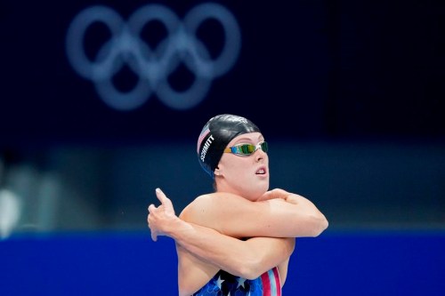 Allison Schmitt of the United States stretches ahead of her swim in a women's 200-metre freestyle semifinal at the 2020 Summer Olympics, Tuesday, July 27, 2021, in Tokyo, Japan. When Olympic swimmer Schmitt was 20 years old doctors advised her to have an intrauterine device implanted to help with her anemia. A naturally inquisitive person, she said that the only question she could muster at the time was 