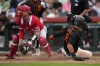 FILE - San Francisco Giants' Blake Sabol (2) steals home ahead of a throw to Los Angeles Angels catcher Max Stassi, left, during the third inning of a spring training baseball game, March 19, 2023, in Scottsdale, Ariz. The Atlanta Braves are sending $6.26 million to the White Sox along with Stassi, covering all of what the catcher is owed next year except for the $740,000 major league minimum salary. Stassi was traded to the White Sox on Saturday, Dec. 9, one day after the catcher was acquired by the Braves in a deal with the Angels. (AP Photo/Ashley Landis, File)