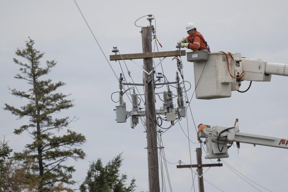 Tens of thousand of residents across the Maritimes woke up this morning without electricity as utility crews scrambled to repair downed power lines after a powerful windstorm roared over the region. Power crews work to fix power lines near Lower Barneys River in Pictou County, N.S. on Wednesday, September 28, 2022. THE CANADIAN PRESS/Darren Calabrese