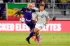 Orlando City's Junior Urso, left, tries to stop CF Montreal's Zorhan Bassong (19) from getting possession of the ball during the first half of an MLS soccer match, Wednesday, Oct. 20, 2021, in Orlando, Fla. Sporting Kansas City has signed Canadian international fullback Bassong for the 2024 MLS season with club options for 2025 and 2026. THE CANADIAN PRESS/AP/John Raoux
