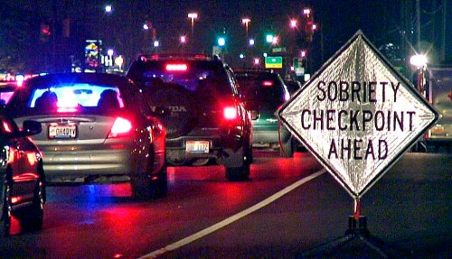 FILE - A sign warns motorists as they approach a sobriety checkpoint on State Route 4 in Fairfield, Ohio June 15, 2007. U.S. auto safety regulators say they have taken the first step toward requiring devices in vehicles that prevent drunk or impaired driving. The National Highway Traffic Safety Administration announced on Tuesday, Dec. 12, 2023, that it is starting the process to put a new federal safety standard in place requiring the technology in all new passenger vehicles. (AP Photo/The Enquirer, Glenn Hartong, File)/The Cincinnati Enquirer via AP, File)