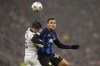 Real Sociedad's Igor Zubeldia fights for the ball with Inter Milan's Lautaro Martinez during a Champions League group D soccer match between Inter Milan and Real Sociedad at the San Siro stadium in Milan, Italy, Tuesday, Dec. 12, 2023. (AP Photo/Antonio Calanni)
