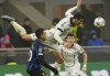 Real Sociedad's Robin Le Normand jumps for the ball Inter Milan's Lautaro Martinez during a Champions League group D soccer match between Inter Milan and Real Sociedad at the San Siro stadium in Milan, Italy, Tuesday, Dec. 12, 2023. (AP Photo/Antonio Calanni)