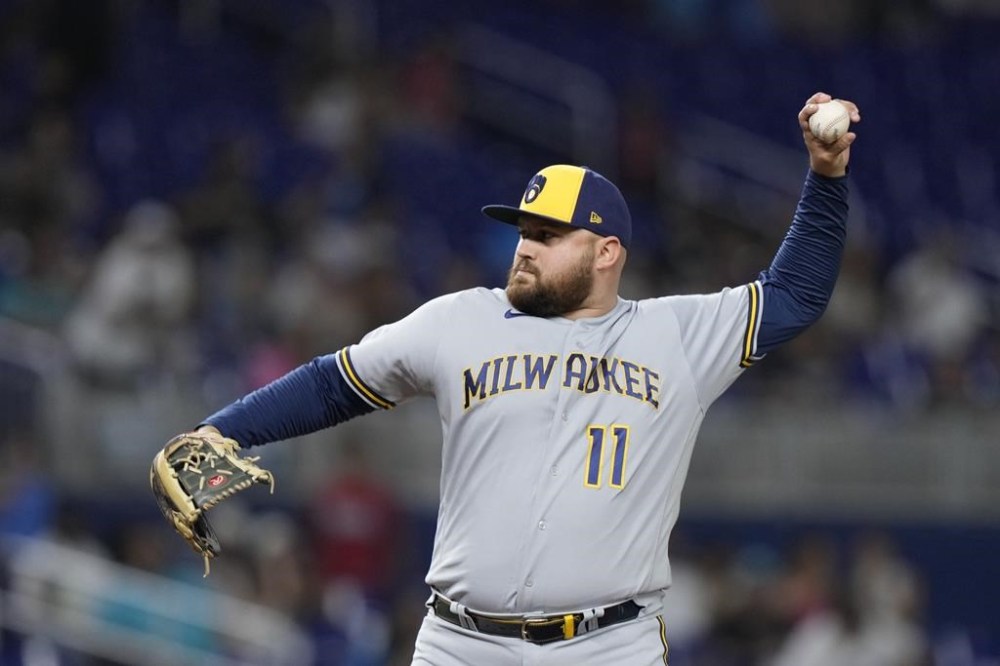 FILE- Milwaukee Brewers first baseman Rowdy Tellez pitches during the ninth inning of a baseball game against the Miami Marlins, Sept. 22, 2023, in Miami. Tellez signed a one-year deal with the Pittsburgh Pirates on Tuesday, Dec. 12, 2023, to fill a void at first base. (AP Photo/Wilfredo Lee, File)