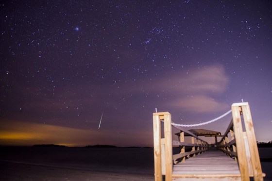 The Geminid meteor shower lights up the night sky above Tybee Island, Ga., in 2017. (Will Peebles / Savannah Morning News via The Associated Press files)