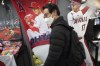 Customers shop around for character goods of Shohei Ohtani of the Los Angeles Dodgers at a sporting goods store, 