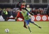 Toronto FC defender Steven Beitashour (33) defends as Seattle Sounders midfielder Nicolas Lodeiro (10) moves the ball during second half MLS Cup Final soccer action in Toronto on Saturday, December 9, 2017. Former Toronto FC fullback Beitashour, part of TFC's treble-winning championship team in 2017, has announced his retirement. THE CANADIAN PRESS/Mark Blinch