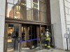 A New York firefighter steps into the main entrance of New York Supreme Court, Wednesday, Dec. 13, 2023, in New York. The courthouse in New York City where former President Donald Trump's civil business fraud trial has been taking place was evacuated Wednesday hours after testimony had concluded for the day. (AP Photo/Jennifer Peltz)