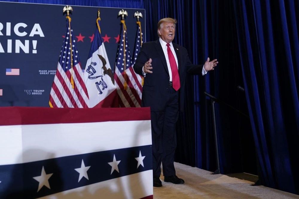 Former President Donald Trump arrives at a commit to caucus rally, Wednesday, Dec. 13, 2023, in Coralville, Iowa. (AP Photo/Charlie Neibergall)