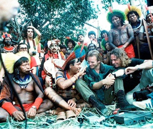 FILE - British musician and activist Sting, second from right, and Belgian filmmaker Jean-Pierre Dutilleux, right, talk with Menkragnoti Kayap Indigenous Chiefs Paulo Payakan, second from left, and Chief Raoni Metuktire, left, during a five-day meeting in Altamira, Brazil, Feb. 21, 1989. For five decades, the Amazonian tribal chief Raoni Metuktire and Belgian film director Jean-Pierre Dutilleux enlisted presidents and royals, even Pope Francis, to improve the lives of Brazil’s Indigenous peoples and protect their lands. The pair befriended celebrities and movie stars. Sting, the musical legend, was one of their greatest champions. (AP Photo/Miro Nunes, File)