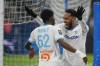Marseille's Michael Murillo, left, celebrates with Pierre-Emerick Aubameyang after scoring his side's second goal during the French League One soccer match between Olympique de Marseille and Lyon at the Velodrome Stadium in Marseille, France, Wednesday, Dec. 6, 2023. (AP Photo/Daniel Cole)