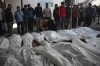 Palestinians mourn their relatives killed in the Israeli bombardment of the Gaza Strip, at the hospital Rafah, Gaza, Tuesday, Dec. 12, 2023. (AP Photo/Fatima Shbair)