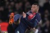 PSG's Kylian Mbappe tries a shot during the French League One soccer match between Paris Saint-Germain and Nantes at the Parc des Princes in Paris, Saturday, Dec. 9, 2023. (AP Photo/Thibault Camus)
