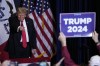 Former President Donald Trump walks off stage during a commit to caucus rally, Wednesday, Dec. 13, 2023, in Coralville, Iowa. (AP Photo/Charlie Neibergall)
