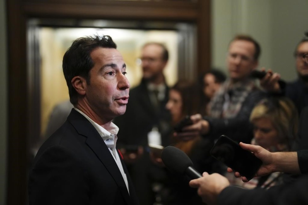 Liberal member of Parliament Anthony Housefather talks to reporters as he arrives to a caucus meeting in Ottawa on Wednesday, Nov. 8, 2023. Five Liberal MPs are asking more than 20 university presidents to say whether calling for a genocide against Jewish people or the elimination of Israel violates its school policies. THE CANADIAN PRESS/Sean Kilpatrick