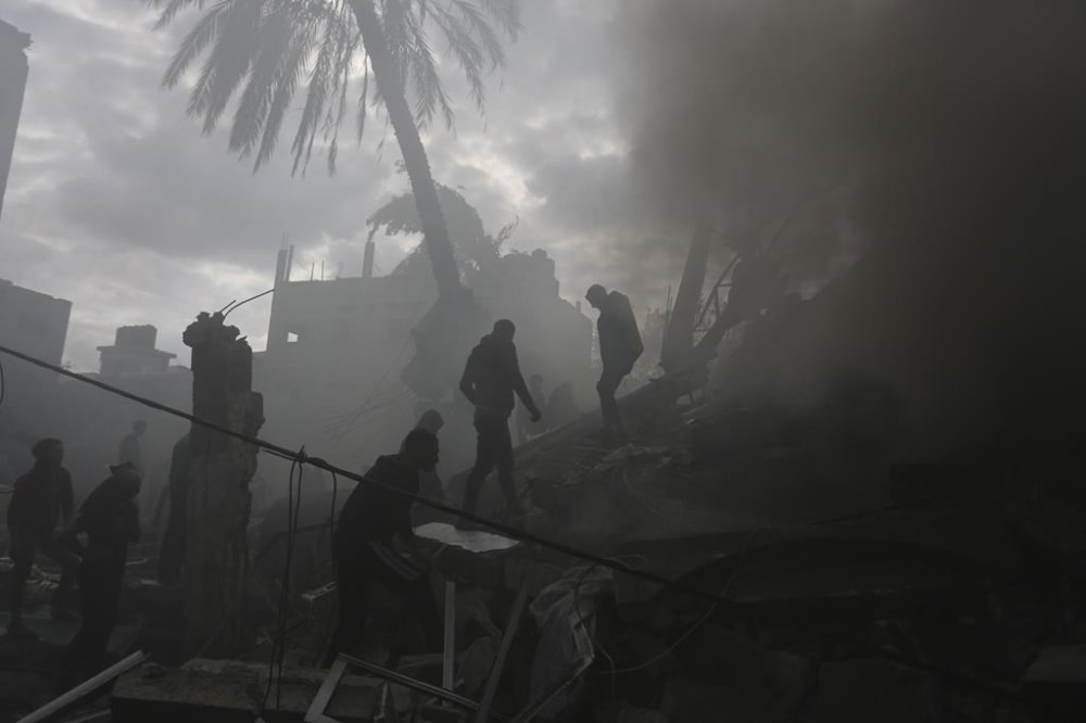 Palestinians look for the survivors of an Israeli strike in Rafah, Gaza Strip, Thursday, Nov. 14, 2023. (AP Photo/Hatem Ali)