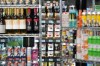 Beer cans are stacked as props in front a display of ice cream, at a press availability attended by Ontario Premier Doug Ford at a convenience store in Toronto, Thursday, Dec. 14, 2023. The Ontario Government announced that in 2026 they will allow beer, wine, cider, coolers and pre-mixed drinks to be sold at convenience stores, grocery stores and 