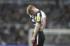 Newcastle's Anthony Gordon reacts after missing a scoring chance during the Champions League group F soccer match between Newcastle United and AC Milan at St. James' Park, in Newcastle, England, Wednesday, Dec. 13, 2023. (AP Photo/Scott Heppell)