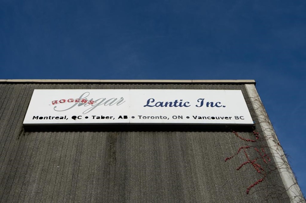 The Rogers Sugar and Lantic sign is shown outside of the Rogers sugar refinery in Vancouver, on Thursday, Nov. 16, 2023. Rogers Sugar Inc. says it is pausing negotiations after the union representing striking workers at its Vancouver refinery rejected the company's latest offer. THE CANADIAN PRESS/Ethan Cairns