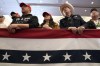 FILE - Audience members listen to former President Donald Trump speak during a commit to caucus rally, Wednesday, Dec. 13, 2023, in Coralville, Iowa. (AP Photo/Charlie Neibergall, File)