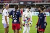 FILE - Washington Spirit co-owner Y. Michelle Kang, third from left, talks to Spirit players after an NWSL soccer match against Racing Louisville FC, Saturday, Oct. 9, 2021, in Washington. Washington Spirit majority owner Michelle Kang has acquired The London City Lionesses soccer team, it was announced Friday, Dec. 15, 2023. (AP Photo/Amanda Andrade-Rhoades, File)