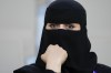 A woman waits for to the Soccer Club World Cup second round soccer match between Club Leon and Urawa Reds at Prince Abdullah Al-Faisal Stadium in Jeddah, Saudi Arabia, Friday, Dec. 15, 2023. (AP Photo/Manu Fernandez)