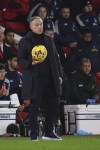 Nottingham Forest's head coach Steve Cooper holds the ball during the English Premier League soccer match between Nottingham Forest and Tottenham Hotspur at City ground in Nottingham, England, Friday, Dec. 15, 2023. (AP Photo/Rui Vieira)