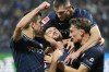 Bochum's Kevin Stoeger, center, is celebrated by his teammates after he scored his side's third goal with a penalty during the German Bundesliga soccer match between VfL Bochum and Union Berlin in Bochum, Germany, Saturday, Dec. 16, 2023. (AP Photo/Martin Meissner)