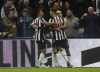 Newcastle United's Lewis Miley, centre, celebrates scoring his side's first goal of the game, during the English Premier League soccer match between Newcastle United and Fulham, at St. James' Park, in Newcastle upon Tyne, England, Saturday, Dec. 16, 2023. (Owen Humphreys/PA via AP)